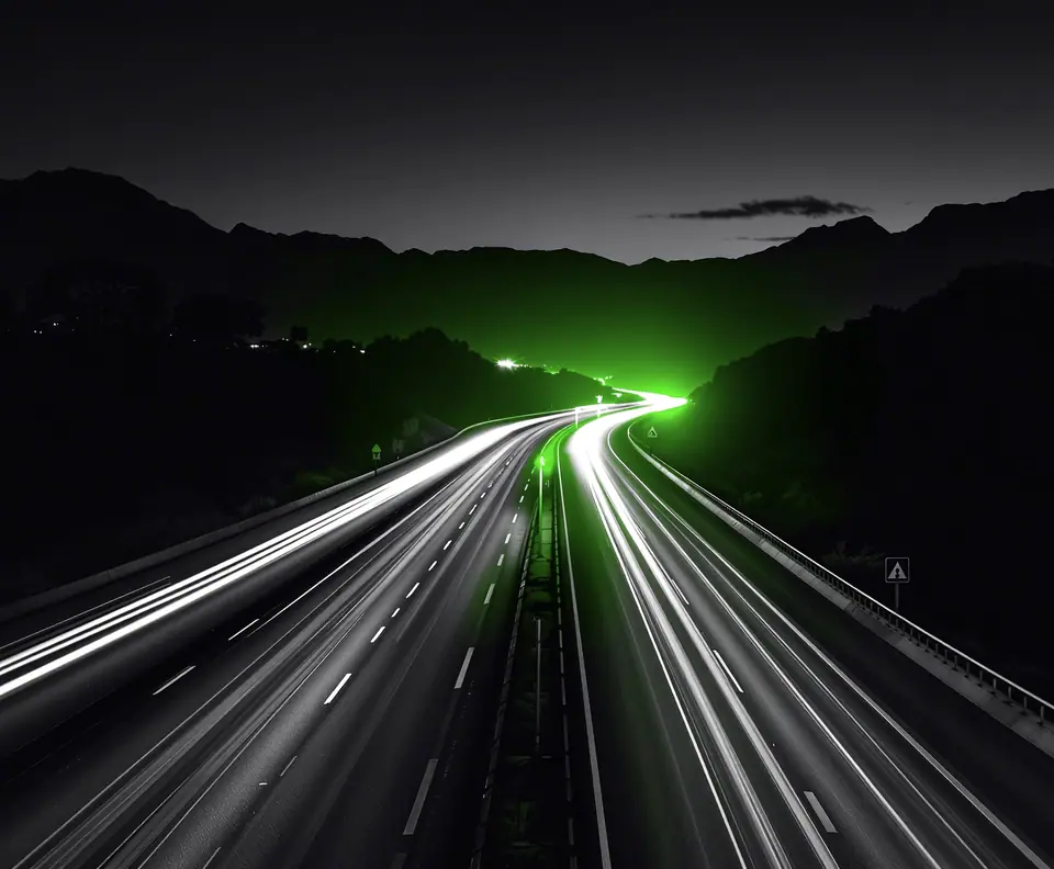Multi-lane avenue at dusk with car and motorcycle light trails and mountains behind: Seguros Mundial digital SOAT sales case study