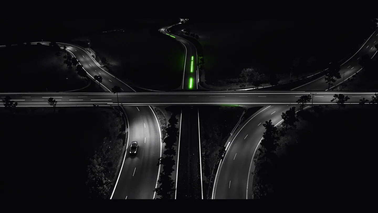 SEO vs SEM: a night highway splitting into a slow organic road and a fast lane with light trails